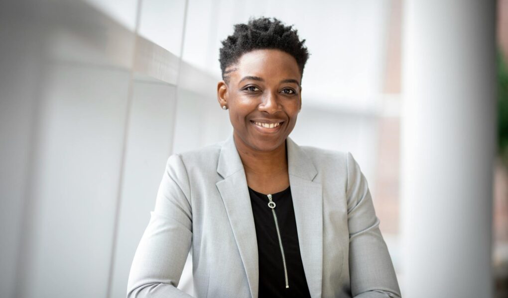 woman wearing gray notch lapel suit jacket