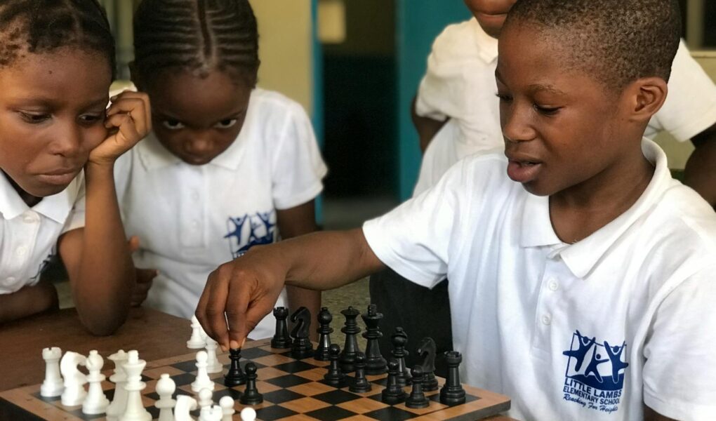 black children playing chess