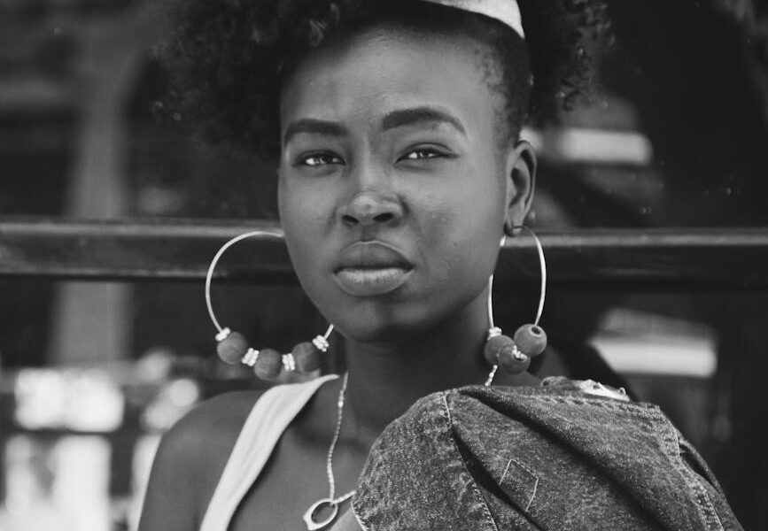 stylish young black woman looking at camera