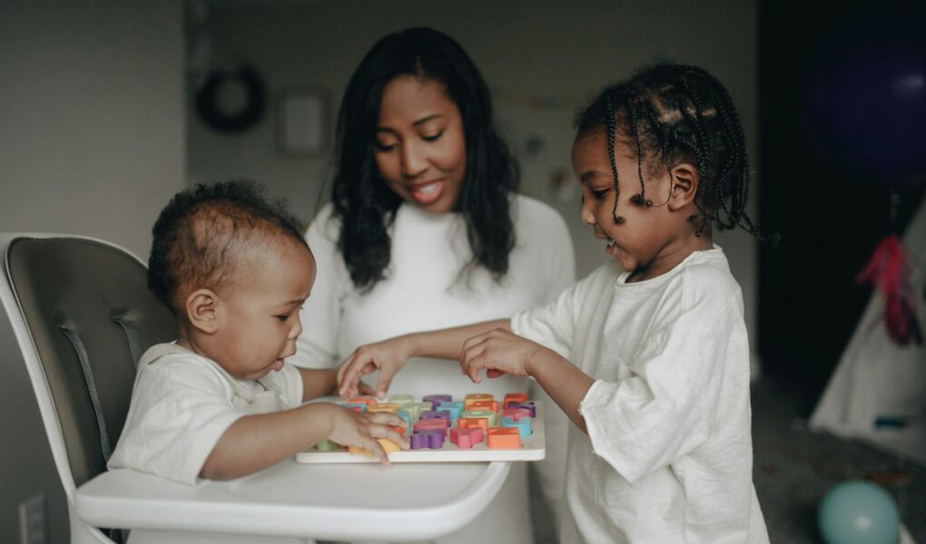 mum and kids playing blocks