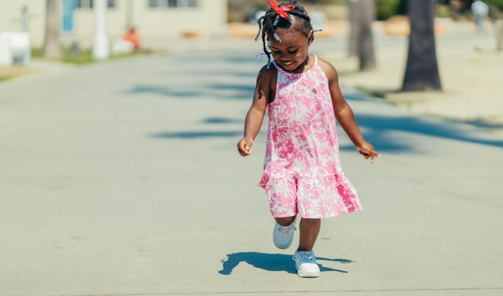 girl in pink dress running