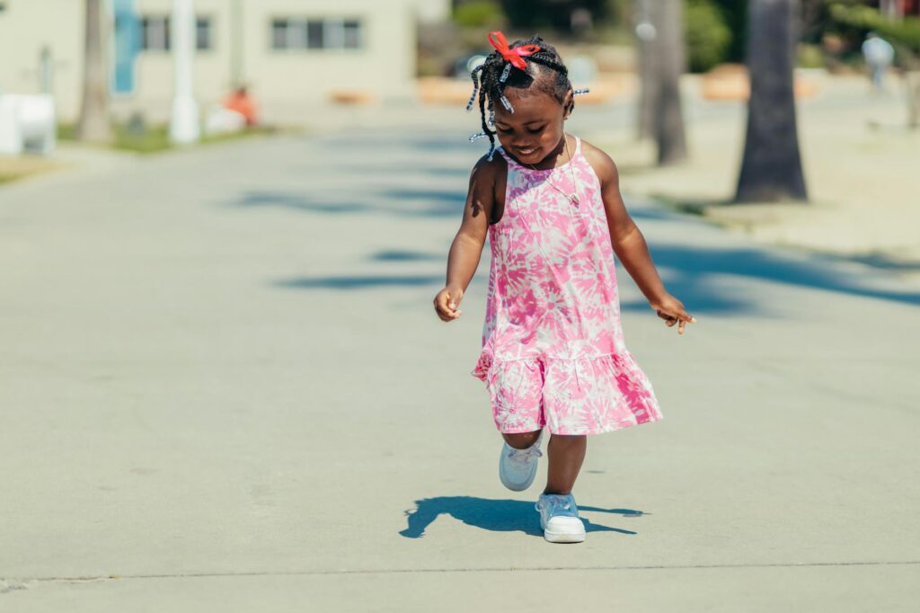 girl in pink dress running
