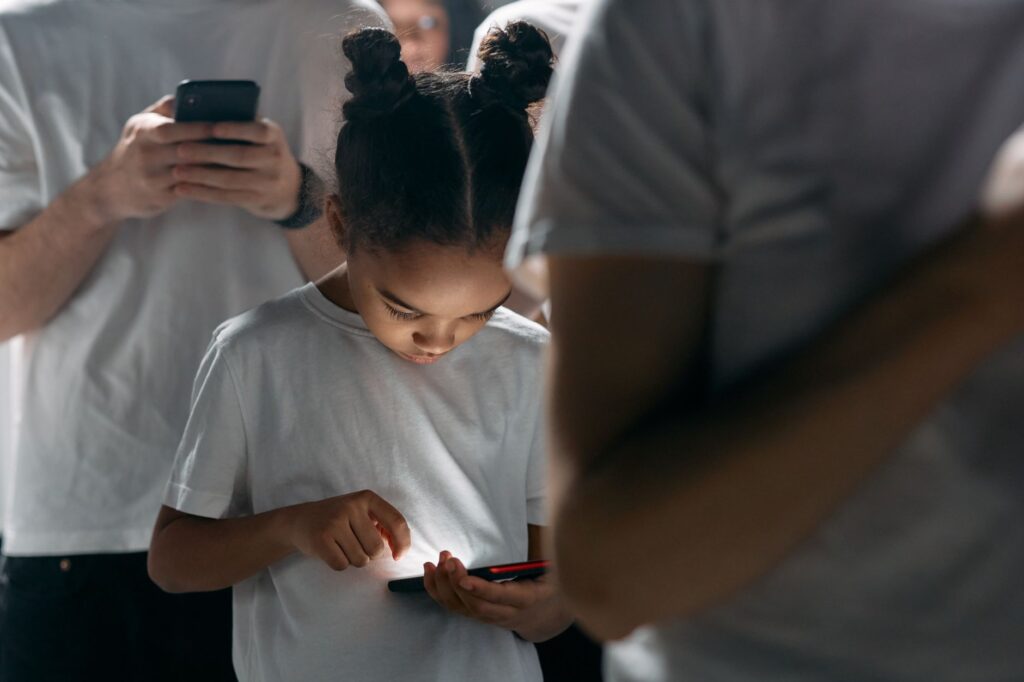 photo of girl using smartphone