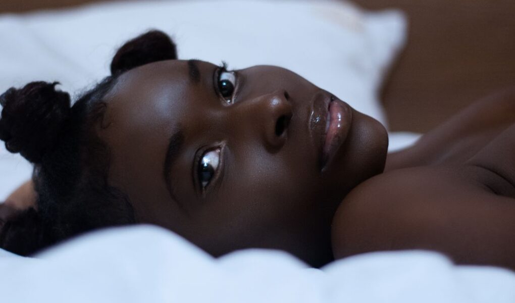 close up of a young woman lying in bed