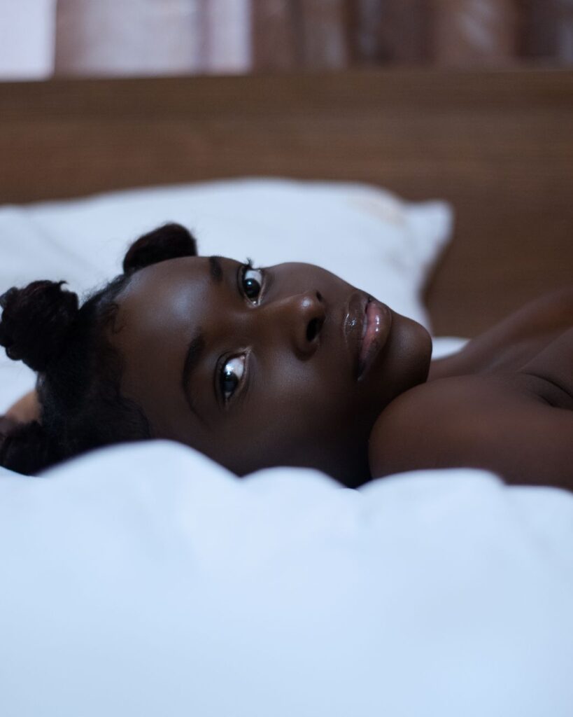 close up of a young woman lying in bed